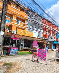 a pink sign in front of a building at Aonang Cozy VIP in Ao Nang 