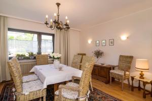 a dining room with a table and chairs at Ferienhaus Faltmann in Heimbach