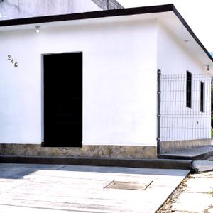 a white building with a black door at Suite moderna para 2, a 5 min del Centro in Ciudad Victoria
