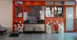 a restaurant with a counter in a room at Kata Silver Sand in Kata Beach