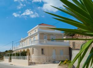 a large white building with a balcony at Apartments Valta View in Katelios