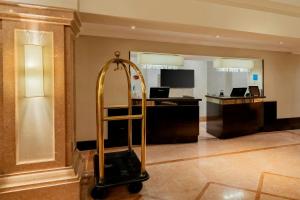 a hotel room with a luggage cart in a lobby at JW Marriott Rio de Janeiro in Rio de Janeiro