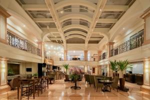 a lobby of a hotel with tables and chairs at JW Marriott Rio de Janeiro in Rio de Janeiro +131 photos