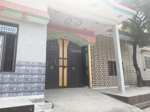 a front door of a house with a gate at VIPIN homestay in Bāghpat