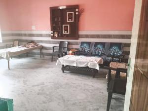 a hospital room with two beds and a mirror at VIPIN homestay in Bāghpat
