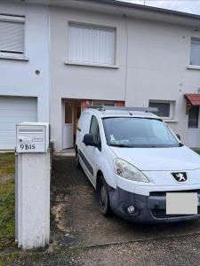 a white van parked in front of a house at L'escapade in Bourg-en-Bresse