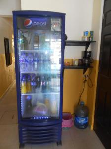 a blue refrigerator filled with lots of drinks at Rincón del Ángel in Villahermosa