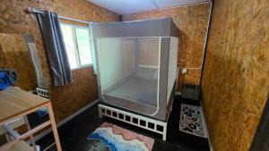 an unfinished room with a large screen in the corner at Hostel Ko Kut in Ko Kood