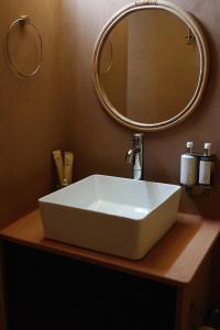 a bathroom with a white sink and a mirror at Liwa Nights ليالي ليوا in Liwa +72 photos