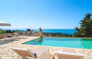 a villa with a swimming pool with a view at Villa Asteri in Vlachopoulátika +18 photos