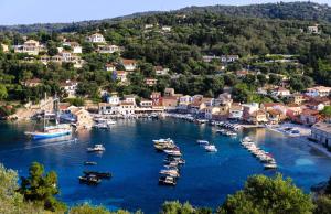 an aerial view of a harbor with boats in the water at Villa Asteri in Vlachopoulátika