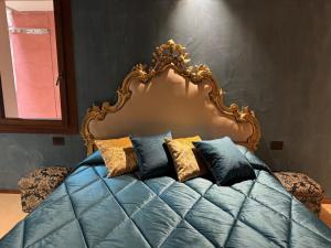 a bed with an ornate headboard in a bedroom at NEW OPENING San Marco Secret 4343 in Venice