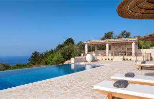 a villa with a swimming pool and a pavilion at Villa Moundela in Katsimátika +27 photos