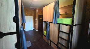 a room with two bunk beds in an rv at Hostel Ko Kut in Ko Kood