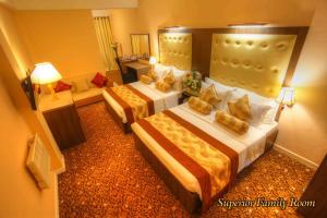 Voodi või voodid majutusasutuse The Queensburry City Hotel toas