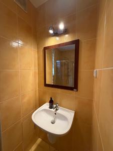 a bathroom with a sink and a mirror at JustInRent Next by Gallery Szpitalna 4D-2 in Legnica +15 photos