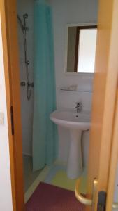 a bathroom with a sink and a shower with a mirror at Locanda da Lucia in Noventa di Piave +6 photos