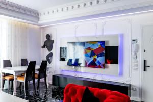 a living room with a couch and a table at New Beach Suite in Sarandë