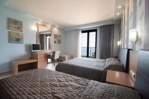 Postel nebo postele na pokoji v ubytování Mistral Hotel