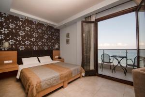 Postel nebo postele na pokoji v ubytování Mistral Hotel