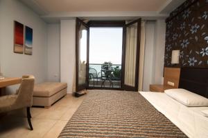 Postel nebo postele na pokoji v ubytování Mistral Hotel