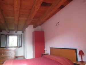 En eller flere senge i et værelse på Agriturismo Frascje Dai Spadons