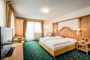 Postel nebo postele na pokoji v ubytování Hotel Maria