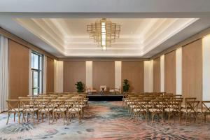 a conference room with rows of chairs and a chandelier at The St. Regis Bermuda Resort in Saint George +95 photos
