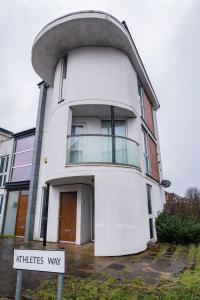 a large white building with a round top at The Way House in Manchester