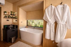 a bathroom with a large white tub and a window at Crown Equine Retreat in North Dandalup +146 photos