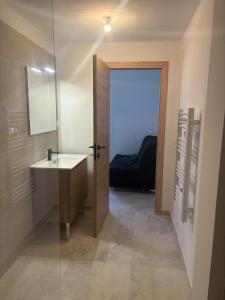a bathroom with a sink and a mirror at Appartement La Colle sur Loup in La Colle-sur-Loup