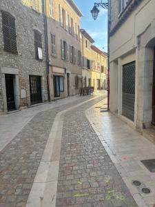 an empty street in an alley with buildings at Appartement La Colle sur Loup in La Colle-sur-Loup +3 photos