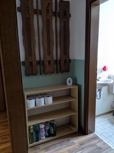a room with skis hanging on a wall at Pension Heller in Odelzhausen