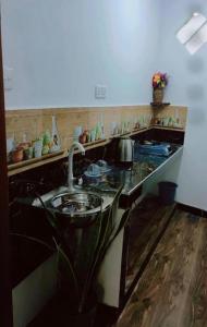 a kitchen with a stove and a counter top at HindaHaven in Weligama