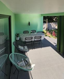 a patio with a table and chairs on a patio at Bilene Harmony Home in Vila Praia Do Bilene