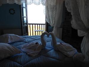 Postel nebo postele na pokoji v ubytování Diogenis Hotel
