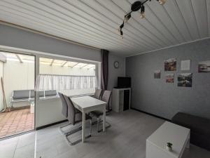 a living room with a table and chairs at Ferienwohnung Tanja in Winterberg