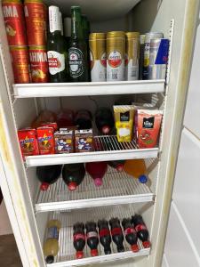 a refrigerator filled with lots of drinks and food at Brito Hospedagem in Barreirinhas