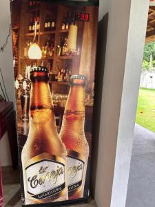 two bottles of beer sitting in a refrigerator at Brito Hospedagem in Barreirinhas +69 photos