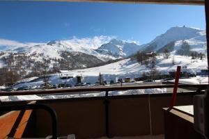 a view of a snow covered mountain from a window at Rifugio nella neve in Sestriere