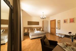a bedroom with a bed and a living room at BBuSS Country Club in Catanzaro +74 photos