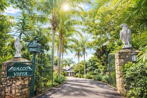 a gate to a villa with a sign on a driveway at Gallo Vista B & B in Gillitts-Emberton
