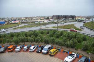 a bunch of cars parked in a parking lot at Royal gaz Hotel in Durrës