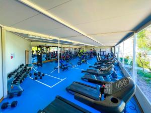 a gym with a bunch of blue chairs in it at Daima Biz Hotel - Dolusu Aquapark Access in Kemer