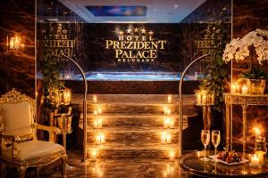 a room with a table and a chair and lights at Prezident Palace Belgrade - Rooftop Pool & Spa Hotel in Belgrade