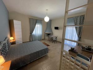 a bedroom with a bed and a fireplace at Namastè Apartments Agrigento in Agrigento