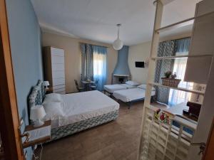 a bedroom with a bed and a living room at Namastè Apartments Agrigento in Agrigento +104 photos