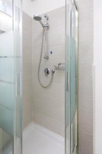 a shower with a shower head in a bathroom at 4 Rent di Cicchinelli Lorella in Albano Laziale +71 photos