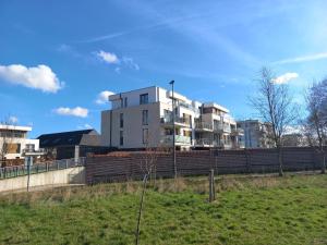 a white building on top of a fence at Monastery Garden - 2 single and little rooms - bed & free breakfast - shared accomodation where landlord lives in Wezembeek-Oppem