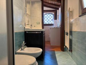 a bathroom with a sink and a toilet at Soffio dell'Etna in Puntalazzo +22 photos